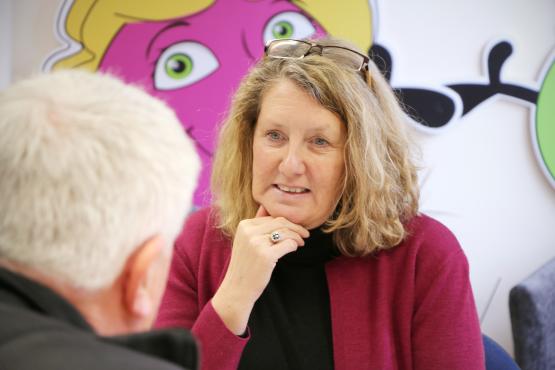 Woman listening during a board meeting