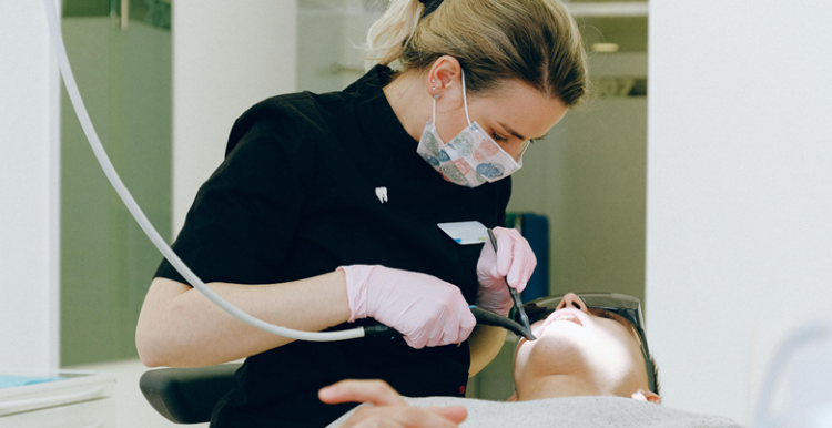 Dentist working in a patient in the dentist's chair