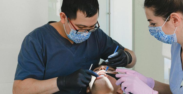 Dentist working on a patient in the chair