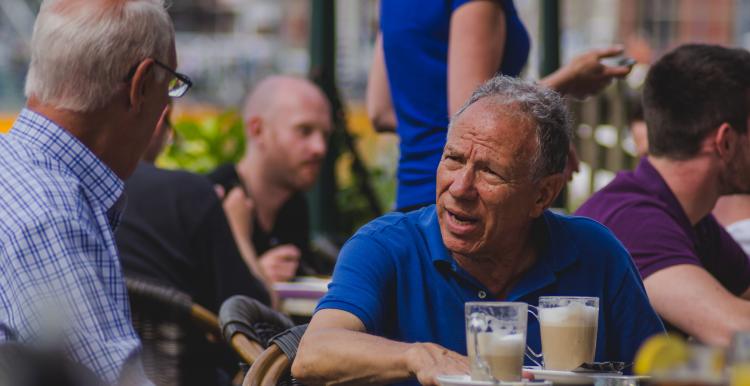 Man sat down having a coffee