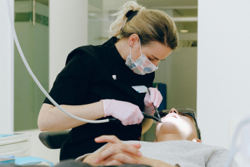 Dentist working in a patient in the dentist's chair