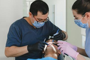 Dentist working on a patient in the chair