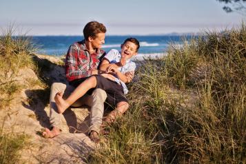 Photo of a dad and his son on a beach