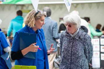 Woman from Healthwatch Cornwall speaking to another woman