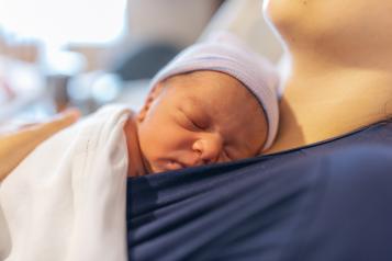 Picture of a small baby being held by mother