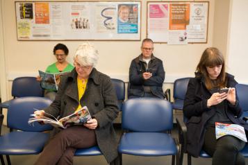 People waiting in a GP Surgery waiting room