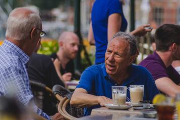 Man sat down having a coffee