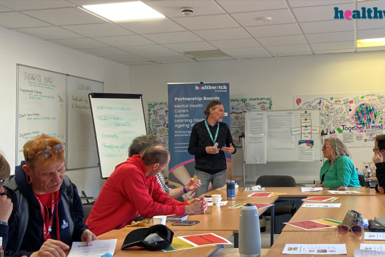 A board meeting in a room