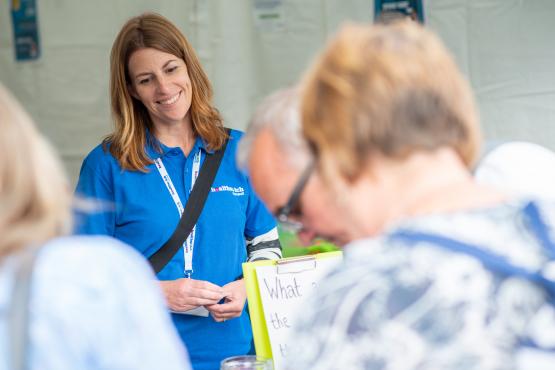 Woman in Healthwatch Cornwall clothes smiling