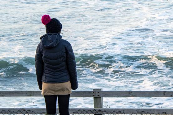 Girl looking out to sea, in cornwall Girl looking out to sea, in cornwall
