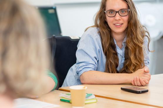 Woman smiling during a meeting