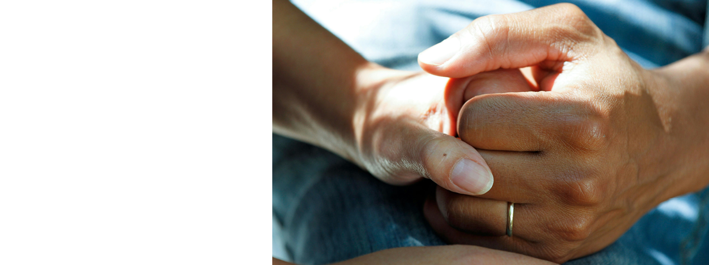 Close up of two holding hands, with a graphic of a mobile phone in the corner. On the screen of the phone it reads 'survey'. 