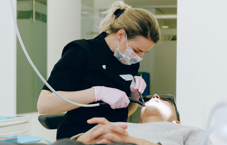 Dentist working in a patient in the dentist's chair